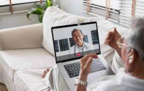 In a virtual conference with a doctor.