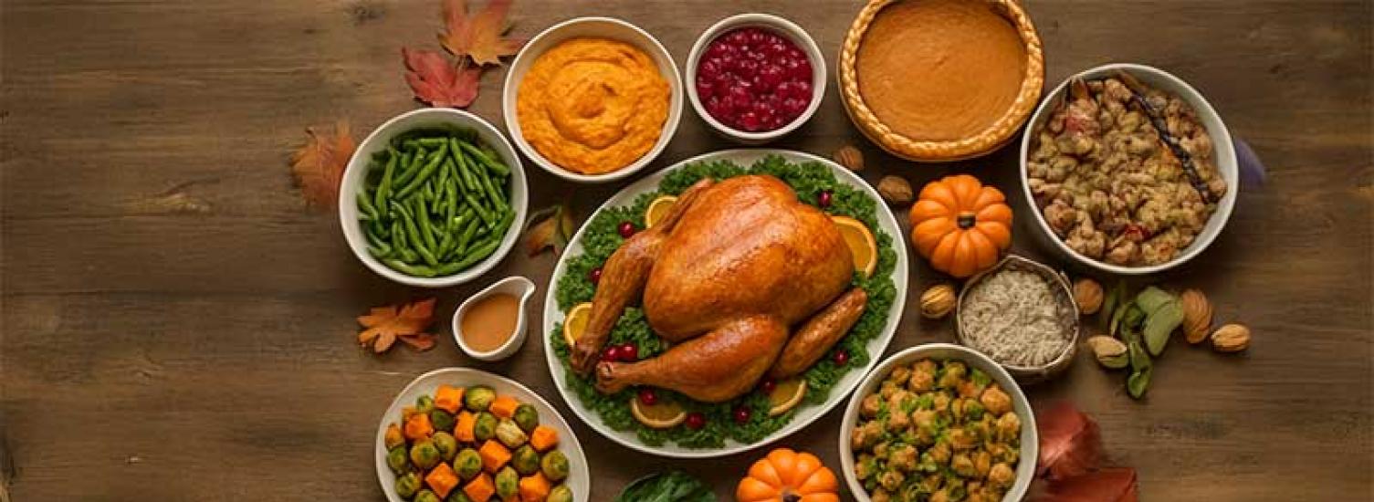 A thanksgiving spread on a wooden surface.