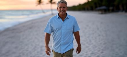 A man walking on the beach.