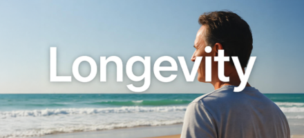 Man looking out into the surf with the word "Longevity" laid over the image.